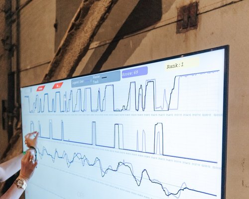 Person studying objective analytical data and charts on a screen
